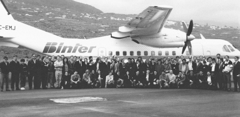 Family photo in front of an ATR on the runway