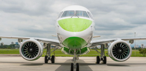 Front view of the nose of an Embraer aircraft in parking
