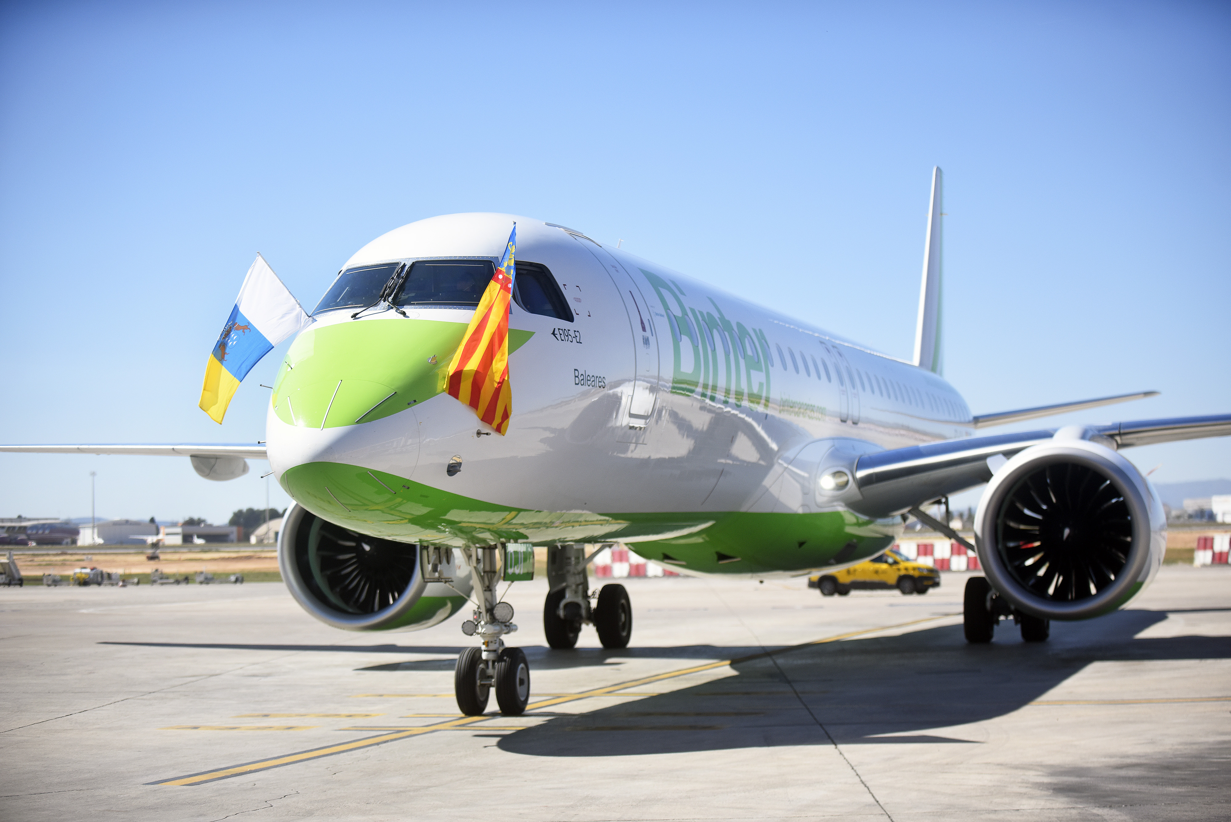 Front view of the nose of an Embraer aircraft in parking